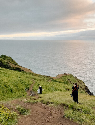 Desiree taking photos of an eloping couple.