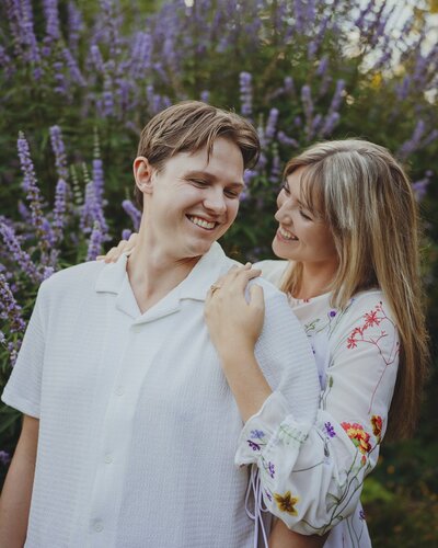 a woman smiling at her fiance