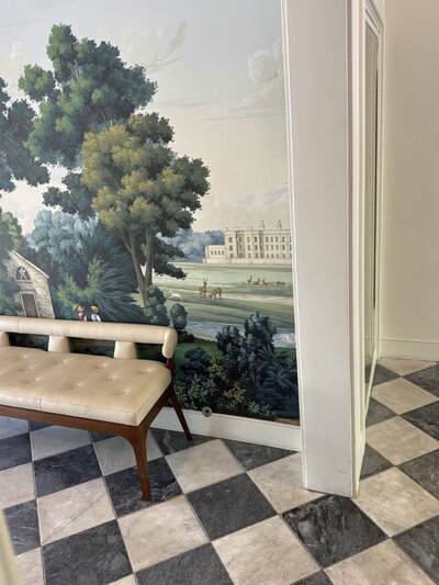 Decorative wall mural in a boutique hotel lobby — representing curated style and thoughtful travel aesthetics.