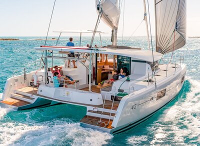 Couple sitting on a Foutaine Pajot Motor Yacht