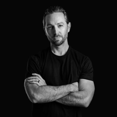Modern headshot captured in-studio with black backdrop by Austin portrait photographer.