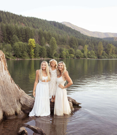 Gorgeous mom with her 2 daughters in the lake