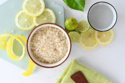 Flay lay of lemons, limes, and a bowl of salt
