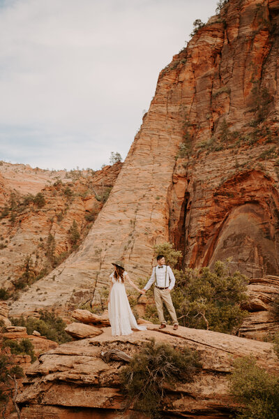 Couples hugging during their engagement session at Cathedral Rock in Sedona, Arizona.
