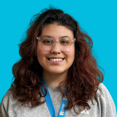 Woman Transitional Living Program Case Manager at Move forward with long dark hair and black glasses