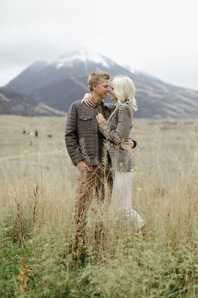 High fashion couple embraces during Montana engagement session