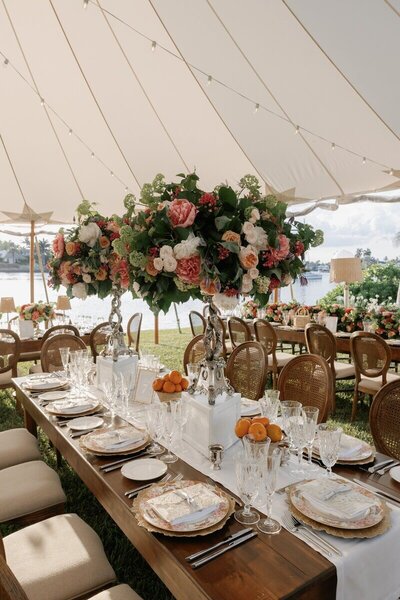 Outdoor tented wedding reception setup in Naples Florida captured by Priscila Del Cristo a Naples Florida wedding photographer.