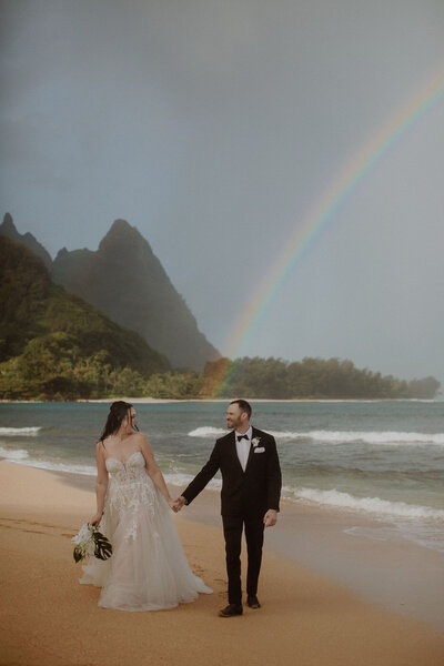 Couple elopes under a rainbow in Kauai