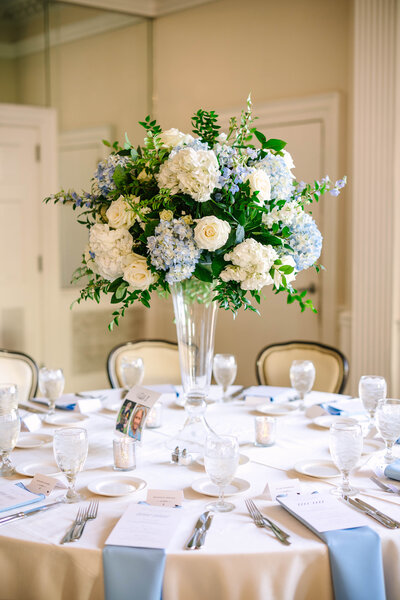 Light blue and white tall floral arrangement at Colonial Country Club.