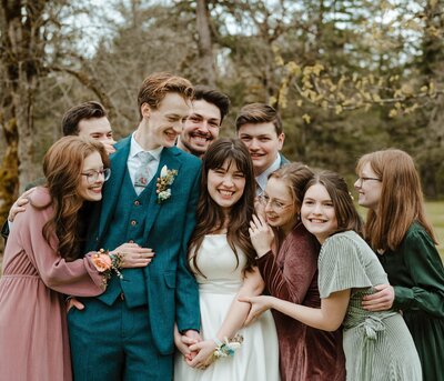 bride and groom taking a photo with their family