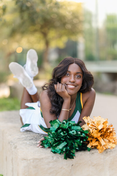 Girl in a brown turtleneck gazes into the camera of San Antonio senior photographer Cassey Golden at Landa Library.