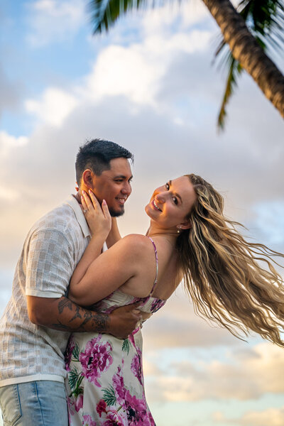 Beach photos with couple taken by hawaii engagement photographer