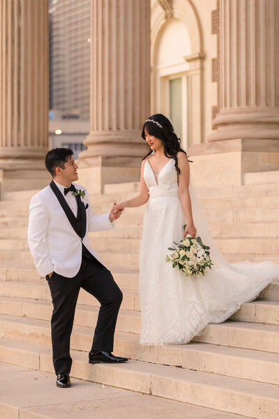 A Dallas wedding photographer expertly capturing the love and emotions of a couple on their wedding day in a vibrant cityscape.