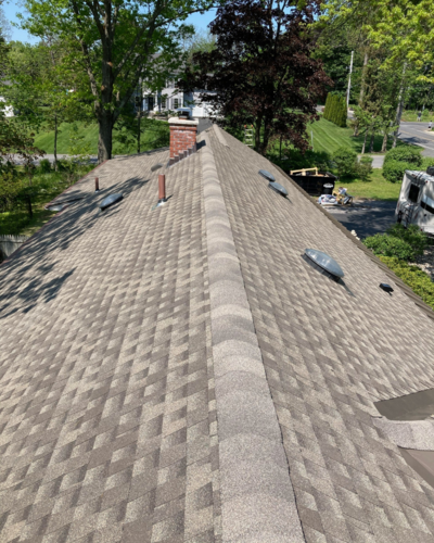 View from on the roof of a new roof with asphalt shingles