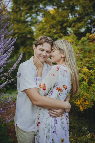 an engaged couple embracing