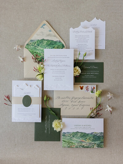 Letterpress and blind embossed wedding invitation with custom Park City watercolor
