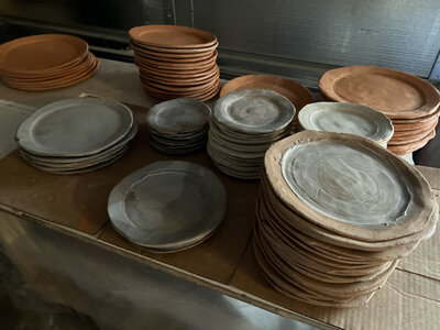 Stacks of beautiful hand thrown ceramic plates