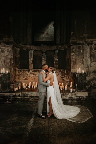 Bride and groom share their first kiss at the Asylum Chapel in London. 