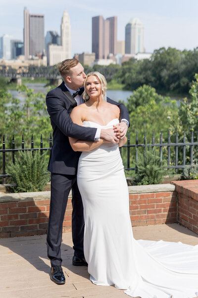 Romantic moment as a couple shares a kiss at the altar, capturing the essence of a perfect wedding day. Girasole & Co. Weddings—Columbus, Ohio’s trusted wedding planner—specializes in creating personalized, unforgettable weddings for engaged couples.