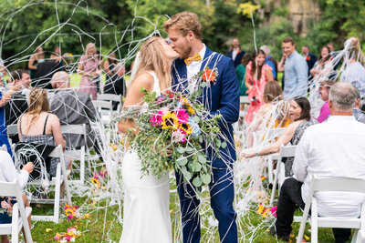 Bride lets veil flow around her on her wedding day.