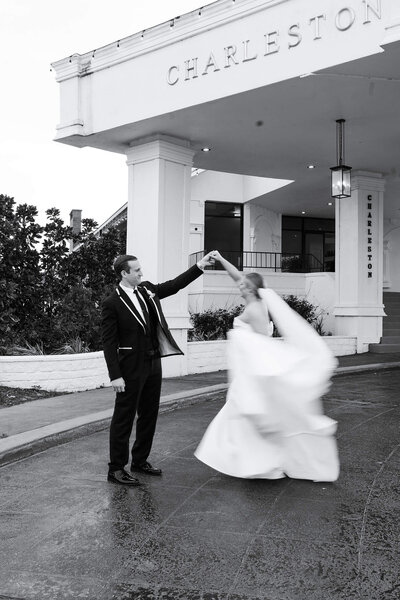 Groom spins bride on their wedding day at Charleston Lane in Houston Texas by Swish and Click Photography