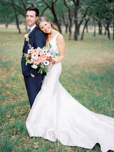 Lindsey and her husband posing on their wedding day