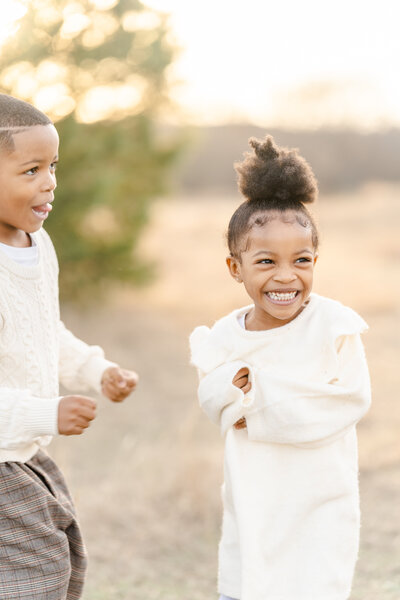 Children laughing by Tonaya Noel Photography