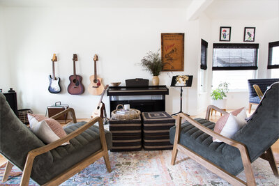 Modern living room with guitars hanging on wall