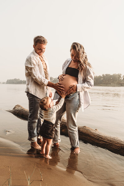A momma shows off her inner diva and stands proud as she carries her next child inside of her belly.