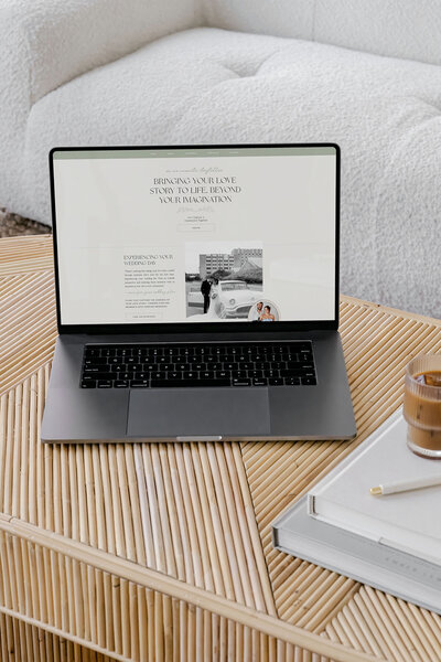 Website pulled up on table showing showit theme customization with Palme Design Co