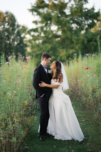 An editorial style groom walking with his jacket open in Chicago, Illinois. 