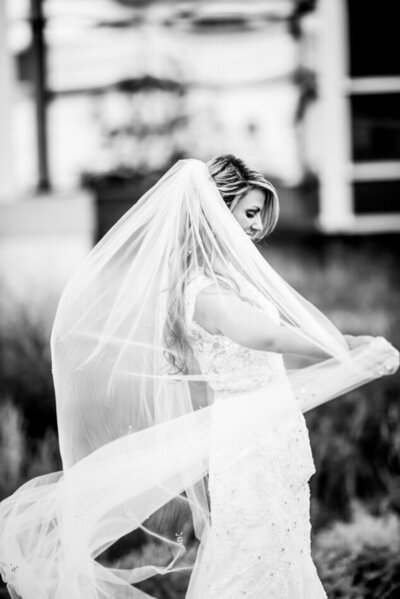 bride twirling with veil in hand in downtown cleveland wedding day
