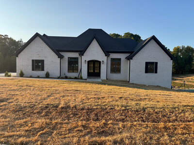 Custom white house with black trim.