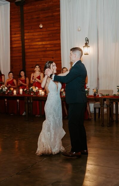 Married couples first dance in their indoor reception