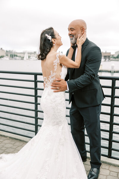 bay area photographers captures bay area wedding with bride and groom eloping on top of a cliff in Big Sur as they kiss each other passionately at their outdoor ceremony