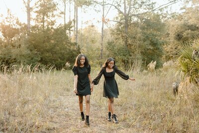 Family photography family photo two children holding hands in field in Tampa Bay, Florida Nadine B Photography