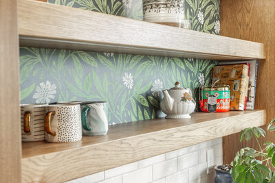 kitchen remodel with green floral wallpaper