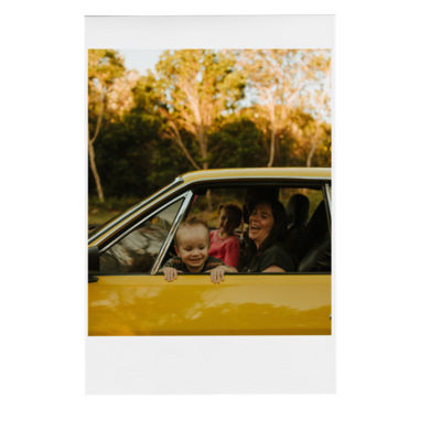 Family photographed sitting in their old yellow Renault 17 by Demi Fraser at Evans Head - Chinamens Beach.