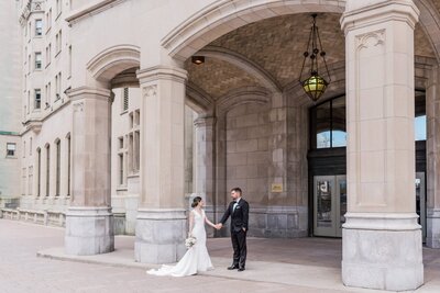 Bride and groom walk up memorial steps at their DC wedding