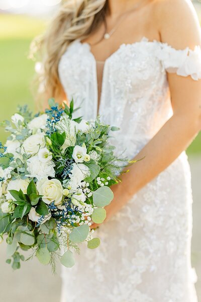 Bride holding flower bouquet