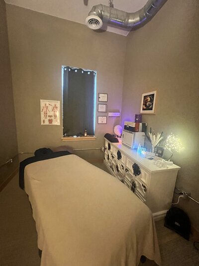 woman with hot stones on back - Massage Therapy in Sun Prairie WI Specific Health Massage Therapy