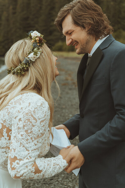 Couple sharing an intimate moment during their elopement on a Washington beach, captured by Bare Bones Photo