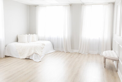 Photo of white fluffy bed in Lauren Wallace Photography Studio