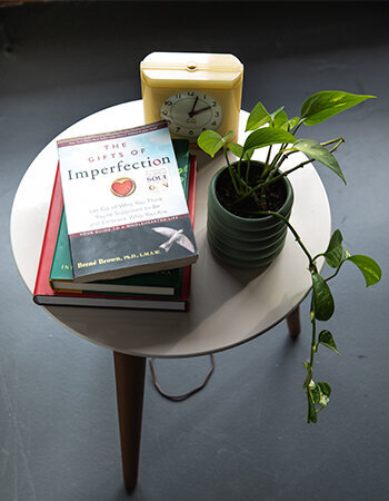 Iconic clock, plant and favorite books from Lori Lubbers Counseling