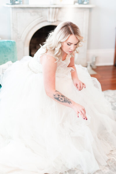 A bride finishes getting ready before her wedding, by Jennifer Marie Studios, Atlanta Georgia light and airy wedding photographer.