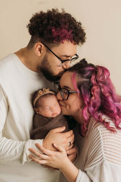 Family of five cuddling on a couch in Harrisburg, PA