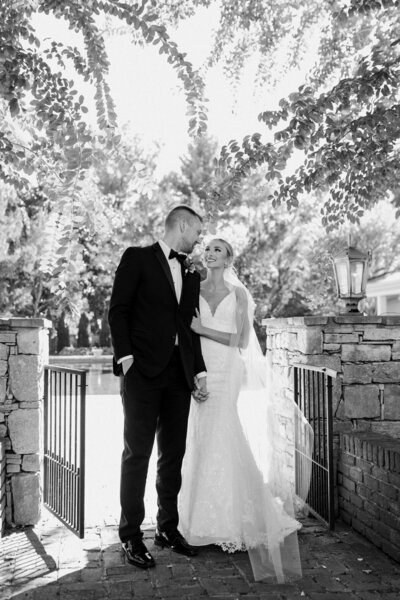 black and white image bride and groom smiling