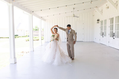 bride and groom dance during formal photos at The Farmhouse wedding venue in Houston Texas by Swish and Click Photography