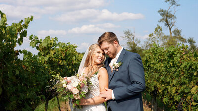 Romantic wedding photo of couple near grape vines at Cross Keys Vineyard, Mt Crawford, VA