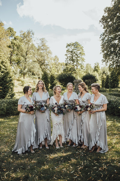 happy bride with her bridesmaids at schenströmska herrgården in sweden